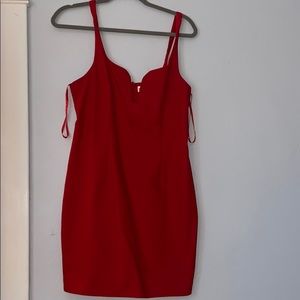 By the way. Red sheath dress.